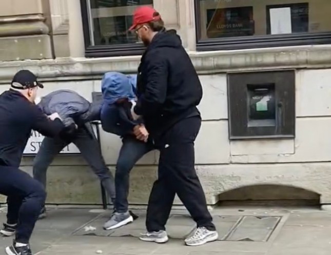 A loverboy prisoner who had flings with two prison staff spent a week on the run after escaping in handcuffs from hospital - and has now been put back behind bars. Gang member Harri Pullen, 27 (PICTURED BEING ARRESTED) had alleged romances with a prison officer and jail nurse during a four-year stretch. He was freed after serving his time behind bars but returned to his life of crime - and has now been jailed for a further six years. Former prison nurse Elyse Hobbs, 27, was previously jailed for her inappropriate relationship with Pullen when he was behind bars. Ruth Shmylo, 26, was sacked from her job as a prison officer over the alleged romance with Pullen after he called her for phone sex from his cell but cleared of criminality during a trial. A court heard Pullen had been free for a matter of months when he was injured resisting officers (PICTURED HERE) who caught him drug-dealing on an e-bike and he was taken to hospital for checks. Pullen was still wearing handcuffs when he made a run through the carpark and ambulance bays of the hospital in Cwmbran, Gwent, and jumped into a 